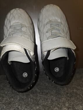Kids / toddler molded-stud athletic soccer and turf cleats.